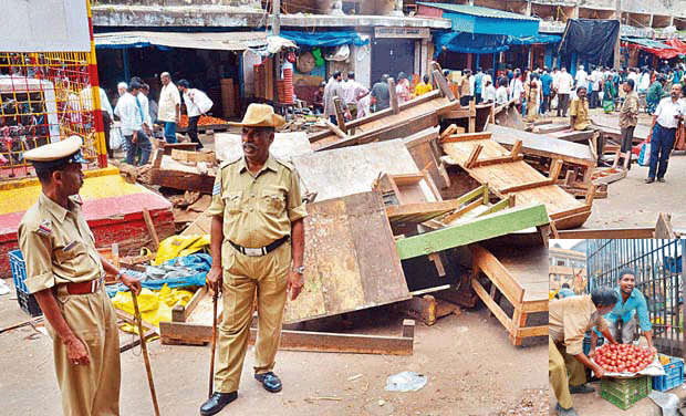 A view of KR Market after BBMP cleared unauthorised shops on Monday. (Inset) Petty traders taking away their goods from the market complex A view of KR Market after BBMP cleared unauthorised shops on Monday. (Inset) Petty traders taking away their goods from the market complex